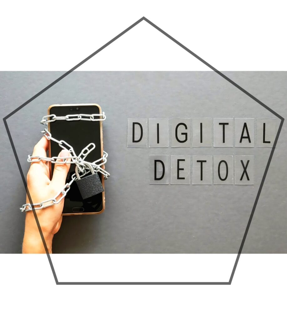 Hand holding a chained mobile phone with a padlock, symbolizing Digital Detox & Stress Management.